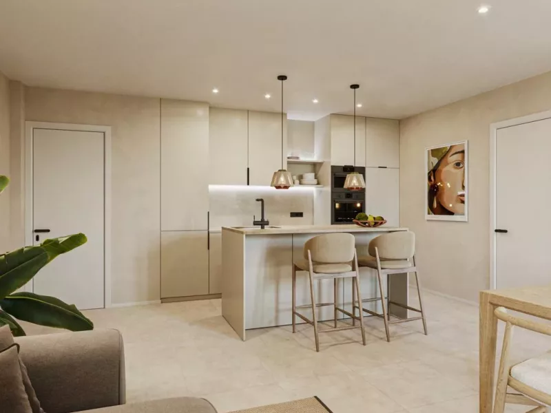 Render de la cocina con isla de una vivienda del Edificio Cervantes